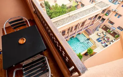 an overhead view of a swimming pool from a balcony at Hotel Oudaya & Spa in Marrakech