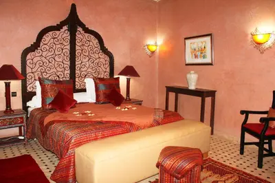 a bedroom with a large bed in a room at Riad Alida in Marrakech