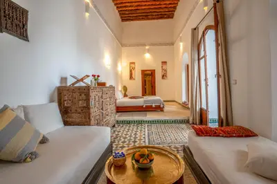 a living room with a couch and a table at Riad Nora in Marrakech