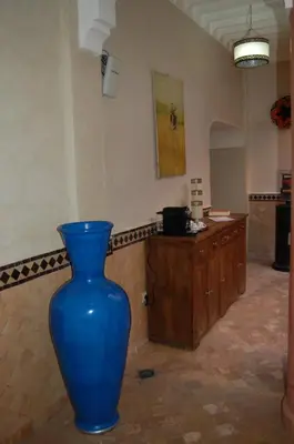 a blue vase sitting on the floor in a room at Riad Le Plein Sud in Marrakech