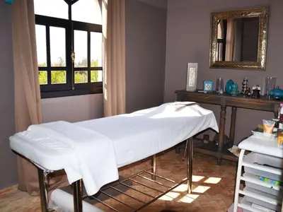 a hospital bed in a room with a window at Palais Lona in Marrakech
