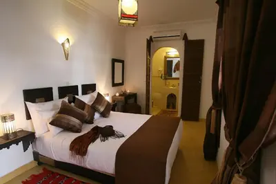 a bedroom with a large bed in a room at Riad Shaloma in Marrakech
