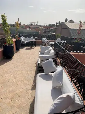 a row of pillows sitting on top of a roof at Riad Abaka hotel & boutique in Marrakech