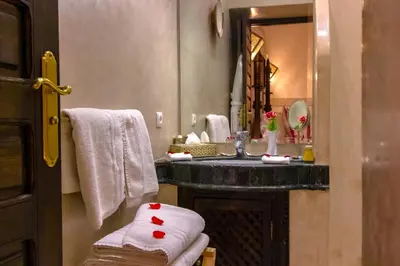 a bathroom with a sink and a mirror at Dar Anika in Marrakech