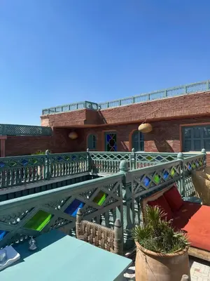 a balcony of a building with stained glass at Riad Ksar Fawz & Spa in Marrakech