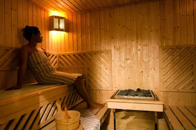 a woman sitting on the edge of a sauna at Tigmiza Boutique Hotel & Spa in Marrakech