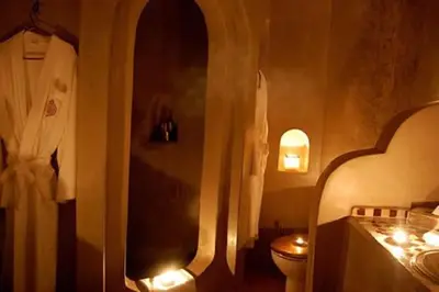 a bathroom with a toilet and a sink at Riad D'Airain in Marrakech