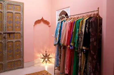 a dressing room with a rack of clothes at The Bohemian Jungle in Marrakech