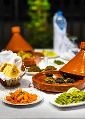 a table with plates of food on a table at Riad Leila Marrakech in Marrakech