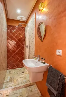 a bathroom with a sink and a shower at Riad Leila Marrakech in Marrakech