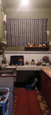 a kitchen with a stove and a counter top at Riad Hayed in Marrakech
