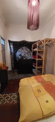 a bedroom with a bed and a bunk bed at Riad Hayed in Marrakech