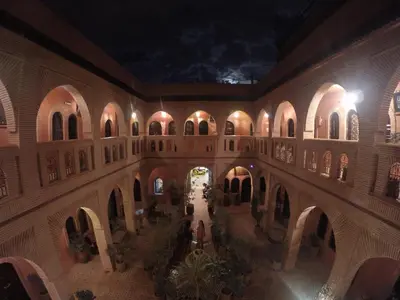 an inside view of a building at night at Hotel Wissam in Marrakech