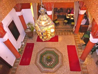 an overhead view of a living room with a chandelier at Riad Lila in Marrakech
