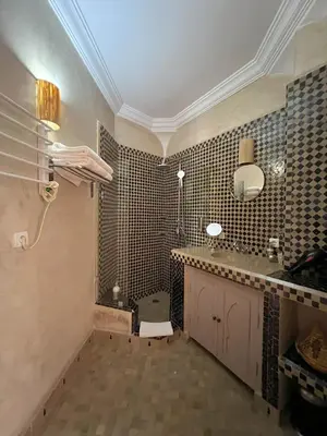 a bathroom with a sink and a toilet in it at Riad Jonan & Spa in Marrakech