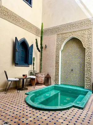 a hot tub in a room with a tile floor at Riad Jonan & Spa in Marrakech