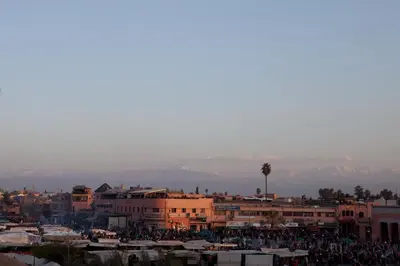 a crowd of people standing around in a city at Riad Le Rubis in Marrakech