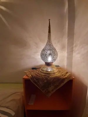 a lamp sitting on top of a table at Riad Manaoui in Marrakech