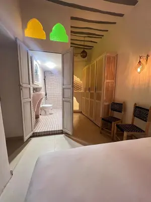 a room with a bathroom with a toilet and a sink at Riad les 2 Portes in Marrakech