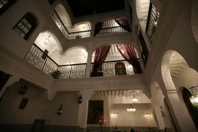 an image of a large building with ceilings and windows at Riad Mouna in Marrakech