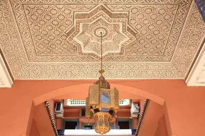 a chandelier hanging from a ceiling in a building at El Hamra Hotel in Marrakech