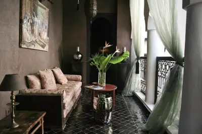 a living room with a couch and a table at Riad Golfame in Marrakech