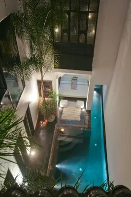 an overhead view of a swimming pool in a house at Riad Golfame in Marrakech