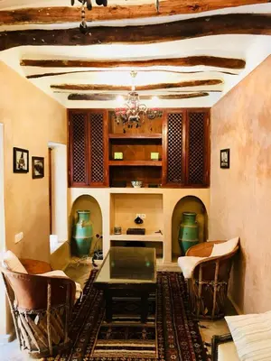 a dining room with a table and chairs at Riad AKL in Marrakech