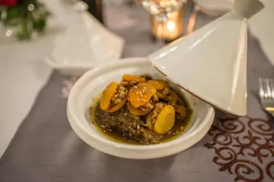 a white bowl of food on a table at Riad Dar Elma And Spa in Marrakech