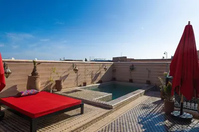 a small swimming pool on the roof of a building at Maison Do in Marrakech