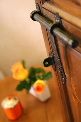 a vase with flowers sitting on a table at Riad CHERRATA in Marrakech
