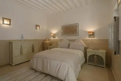 a bedroom with a large bed in a room at Medina Dream Riad Exclusive Rental in Marrakech