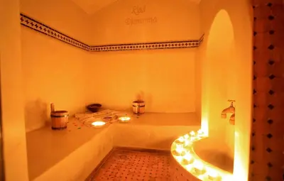 a bathroom with a tub and a toilet and a sink at Riad Djemanna in Marrakech