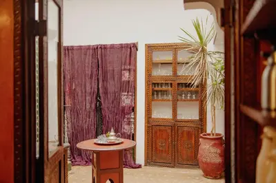 a room with a door and a table and a plant at Outsite Marrakesh in Marrakech
