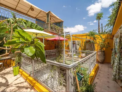 a balcony of a house with plants on it at Riad Eloise in Marrakech