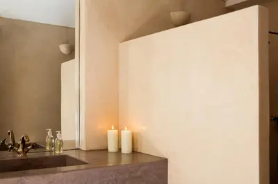 a bathroom with candles on a counter next to a sink at Riad Abracadabra in Marrakech