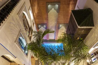 an overhead view of a building with a swimming pool at Riad Tamarrakecht in Marrakech
