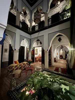 a large living room with a couch and a table at Riad Tamarrakecht in Marrakech