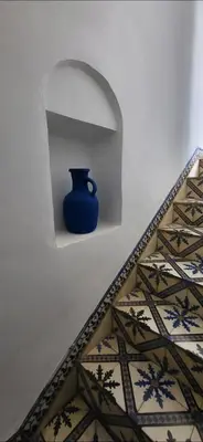 a blue vase sitting on a shelf in a wall at Riad Aloes & Spa in Marrakech