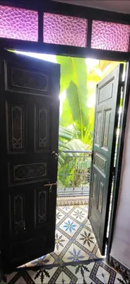 an open door in a room with a tile floor at Riad Aloes & Spa in Marrakech