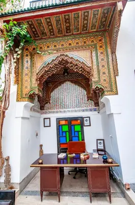 a room with a table and a ceiling at Riad Makila in Marrakech