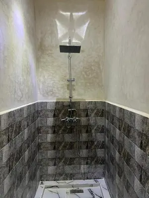 a bathroom with a shower with a sink at For You Riad Marrakech in Marrakech