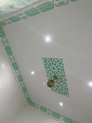 a ceiling with a green and white pattern on it at For You Riad Marrakech in Marrakech
