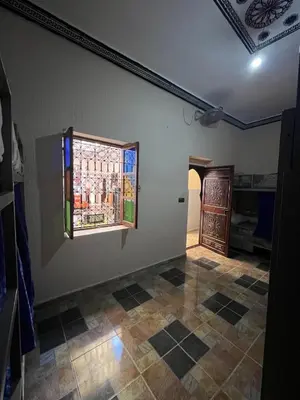 a room with a window and a tiled floor at For You Riad Marrakech in Marrakech