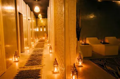 a hallway with candles and lights in a building at Riad Nashira & Spa in Marrakech