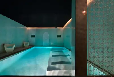 a swimming pool with two toilets in a room at Riad Nashira & Spa in Marrakech