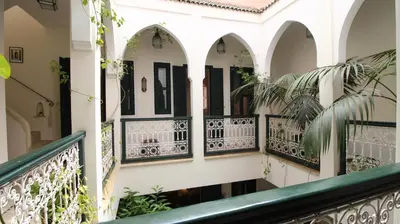 a balcony of a house with black and white railing at Riad Kasbah Baraka in Marrakech