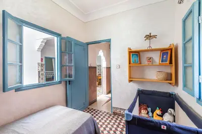 a childs room with a bed with toys in it at Exclusive private Riad in Marrakech