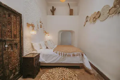 a bedroom with a bed in a room at Riad Sierra in Marrakech