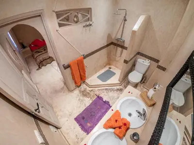 an overhead view of a bathroom with a sink and toilet at Riad Tahani in Marrakech
